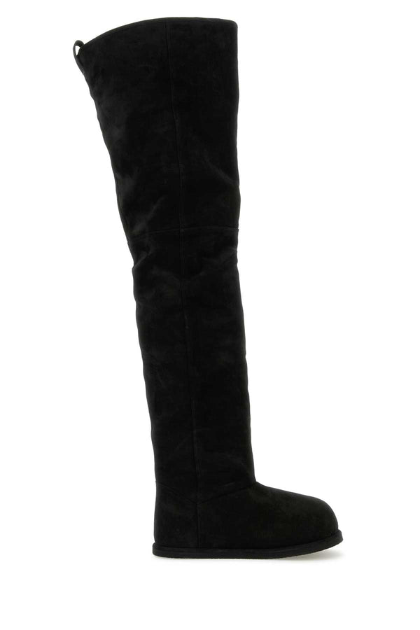 Amina Muaddi Thigh Exterior: 100% Suede; Interior: 100% Shearling; Sole: Rubber boot in black