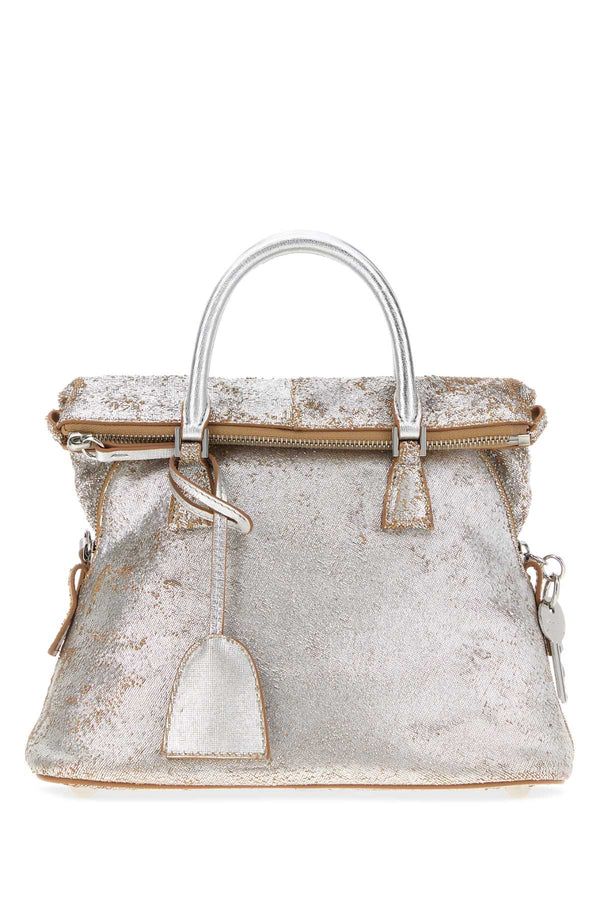 Maison Margiela Exterior: 100% Ovine leather; Lining: 100% Fabric; Finishing: Silver metal top handle bag in silver
