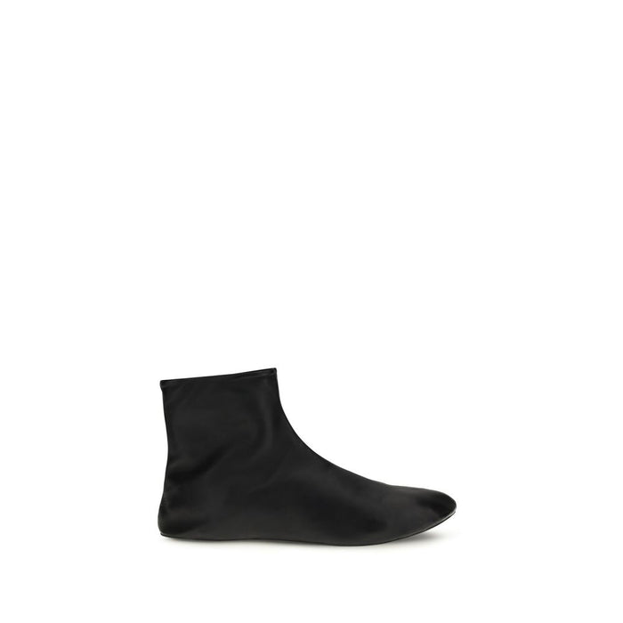 The Row Upper: 100% Lamb leather; Sole: 100% Rubber; Lining: Shearling ankle boot in black