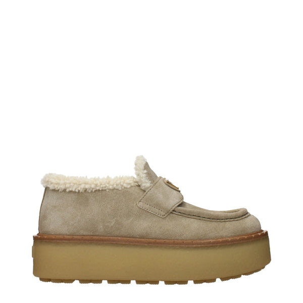 Prada Suede upper with shearling lining and rubber sole loafer in beige