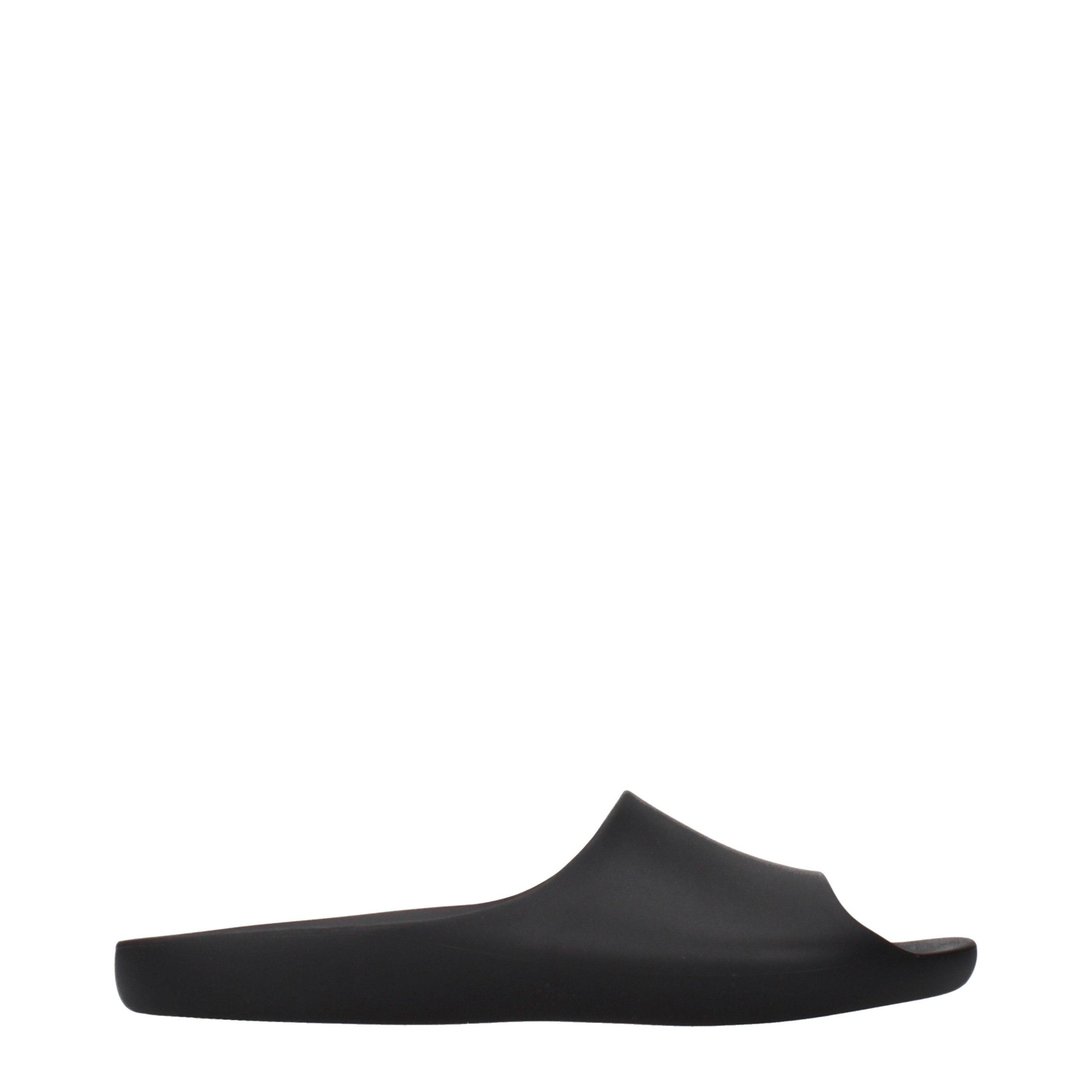The Row slippers in black