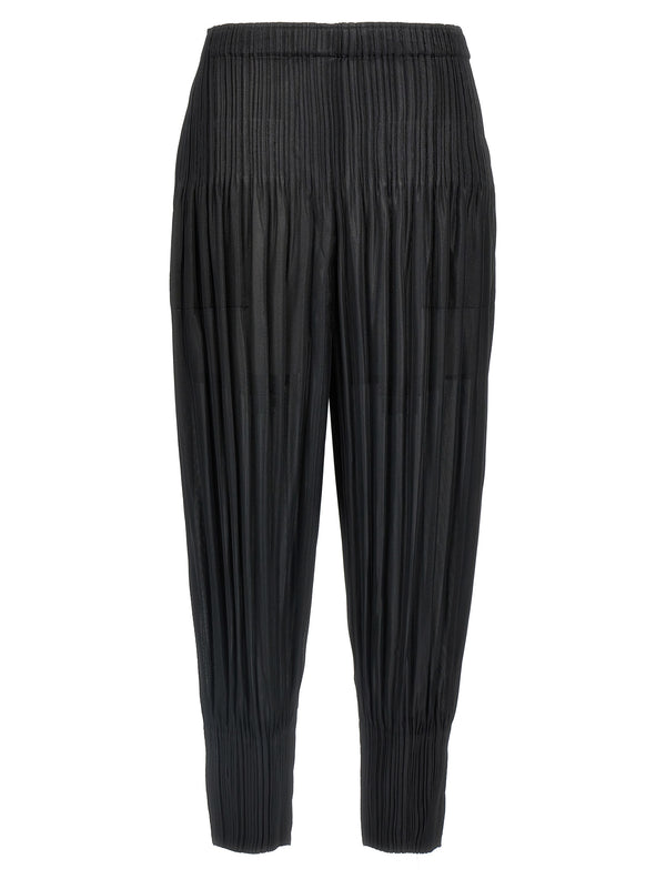 Pleats Please Issey Miyake 100% polyester trousers in black