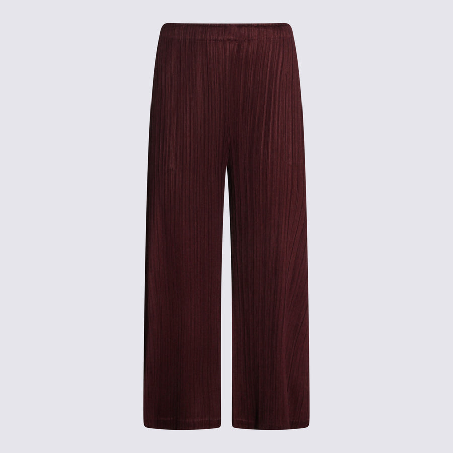 Pleats Please Issey Miyake 100% Polyester trousers in burgundy