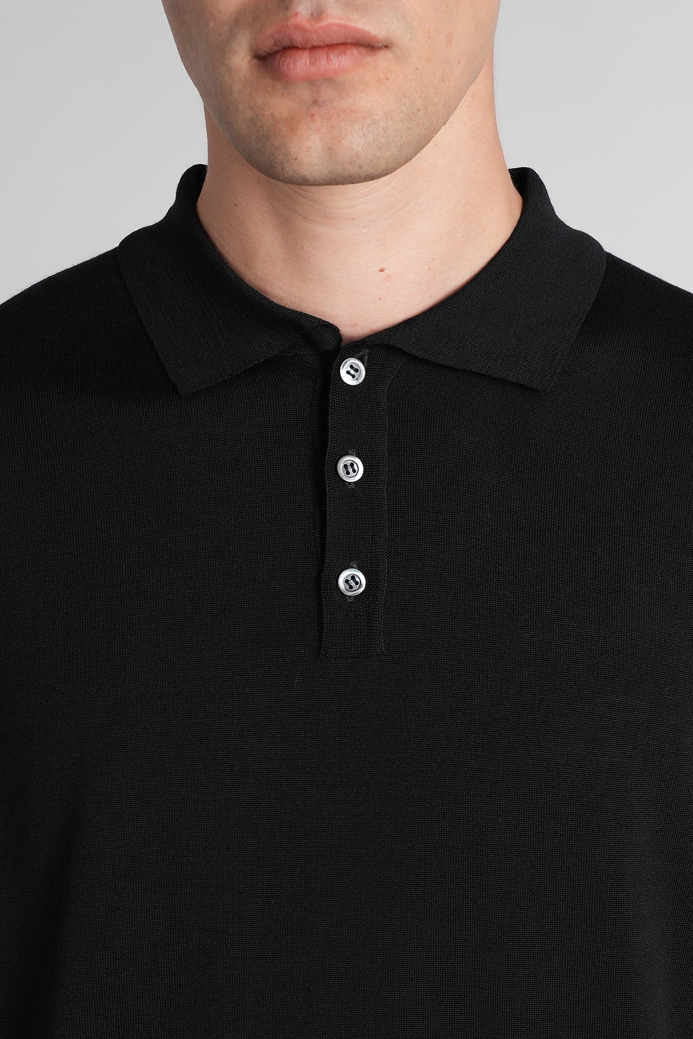 Pevaron Polo in black wool Abbigliamento