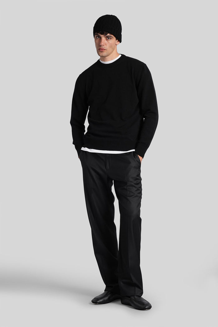 Knitwear in black wool Abbigliamento