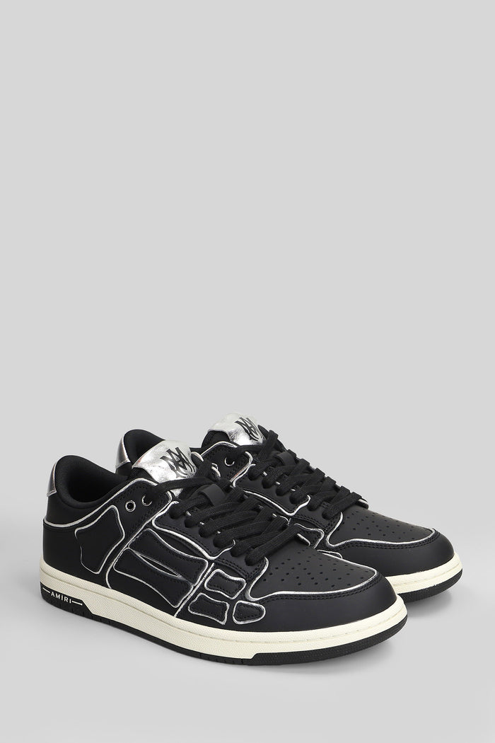 Skel top low Sneakers in black leather Scarpe