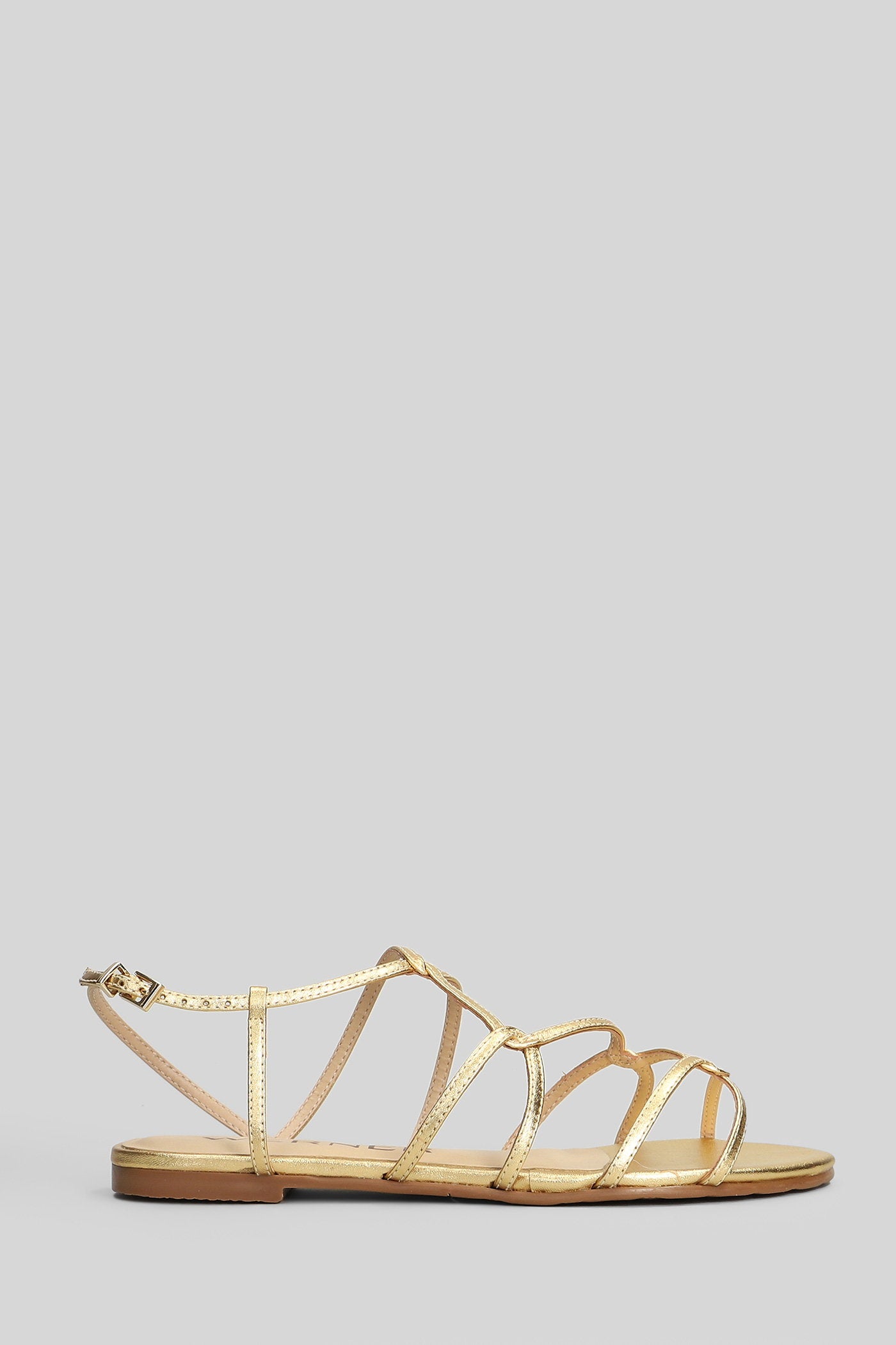 Flats in gold leather Scarpe