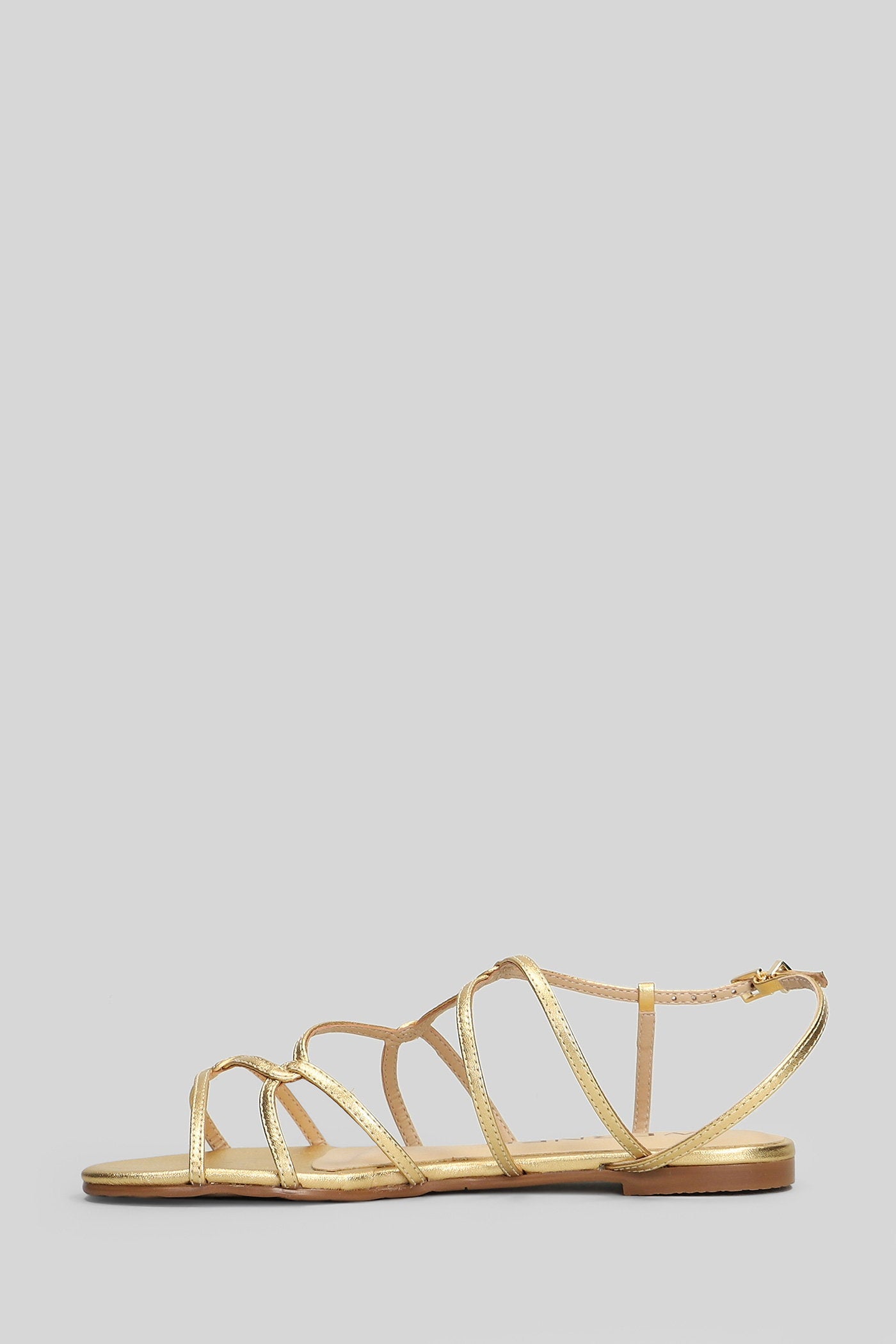 Flats in gold leather Scarpe