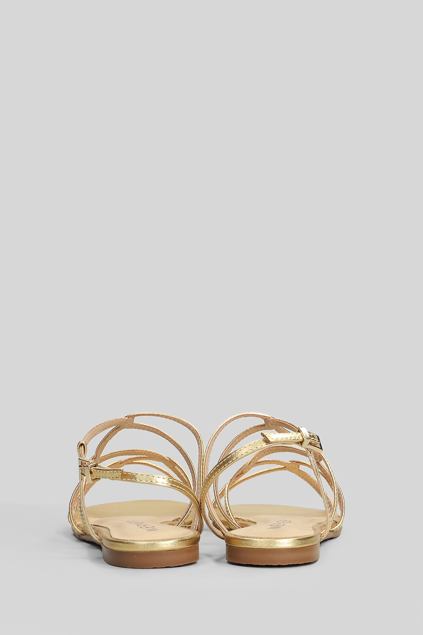 Flats in gold leather Scarpe