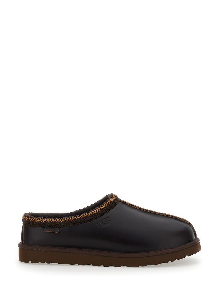 Tasman Black Mules With Embossed Logo On The Side Leather Man Flat Shoes