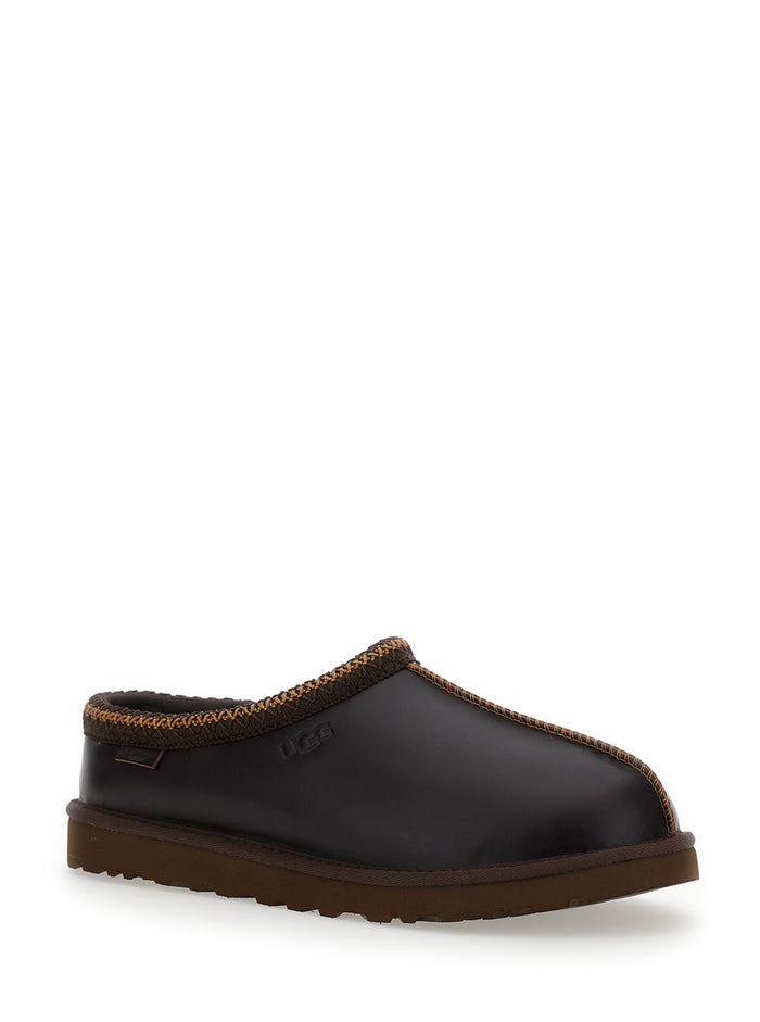 Tasman Black Mules With Embossed Logo On The Side Leather Man Flat Shoes