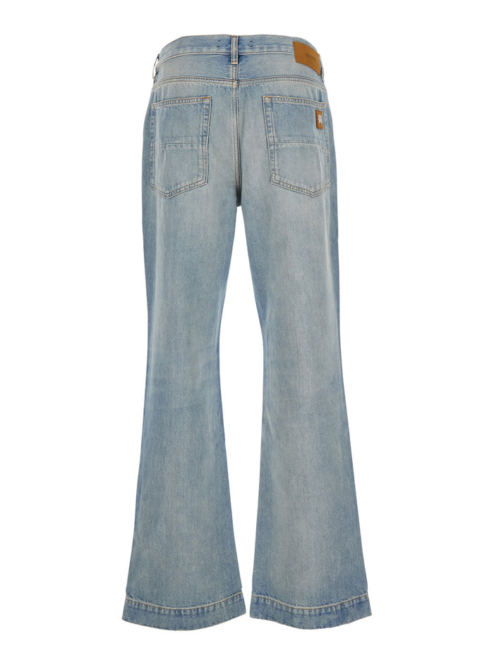 Light Blue Jeans With Flared Leg And Logo Patch On The Rear Denim Man Cotton