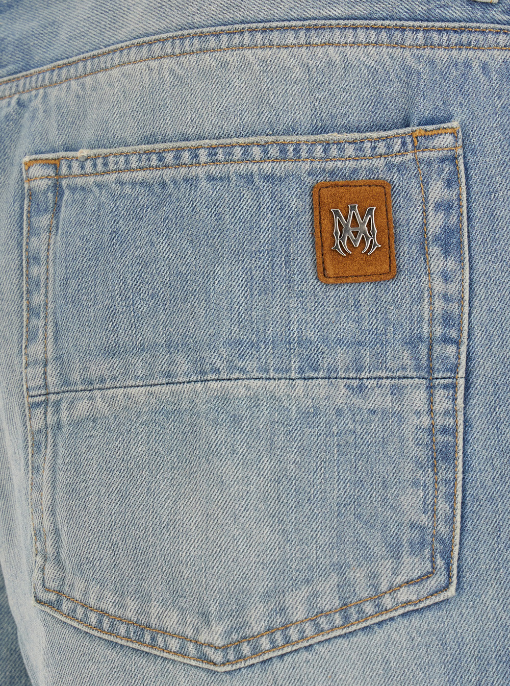 Light Blue Jeans With Flared Leg And Logo Patch On The Rear Denim Man Cotton