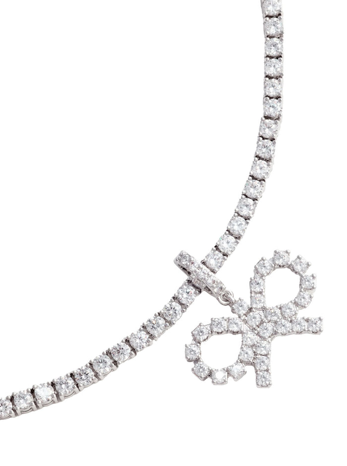 Metallic Tennis Necklace With Bow Charm And Crystal Embellishments Brass Woman Necklaces
