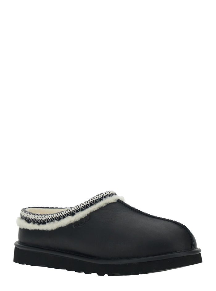 Tasman Black Mules with Embossed Logo in Leather Man Textile Flat Shoes