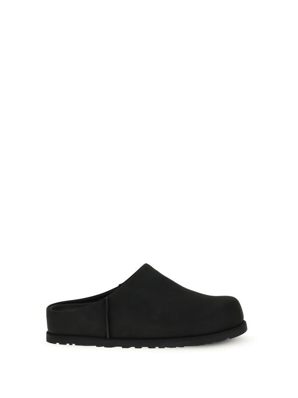 UGG Upper: 100% calf leather; Sole: 100% rubber mule in black