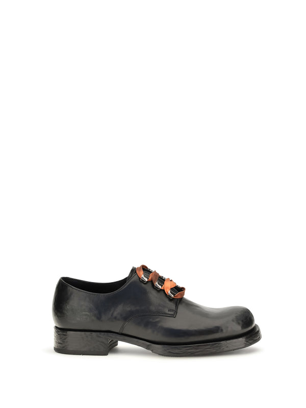 Prada Upper: 100% calf leather; Sole: 100% rubber oxford in black