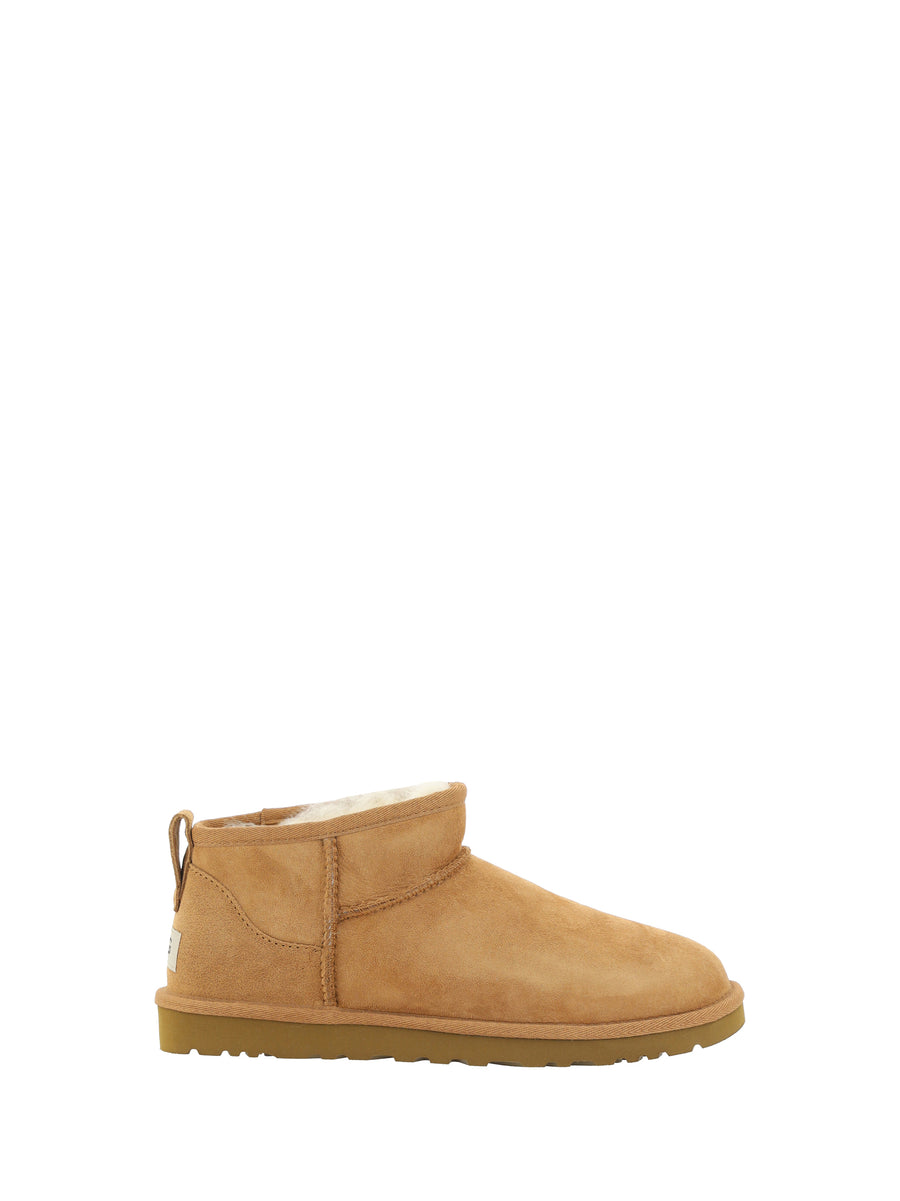 UGG Upper: 100% Mutton; Sole: 100% Rubber boot in brown