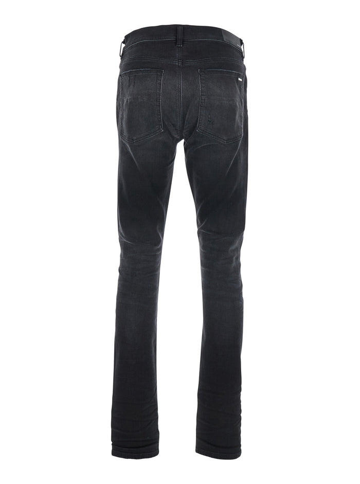 Black Jeans With Ripped Details On The Front And Logo Patch Rear Denim Man