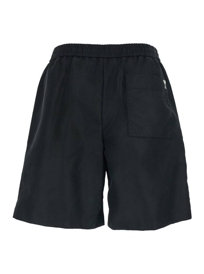 Black Shorts With Elastic Waist And Ami De Coeur Detail On The Back In Tech Fabric Man Bermuda