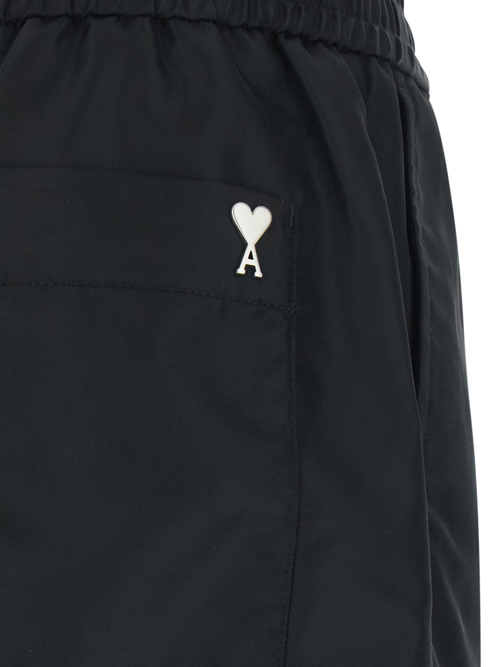 Black Shorts With Elastic Waist And Ami De Coeur Detail On The Back In Tech Fabric Man Bermuda