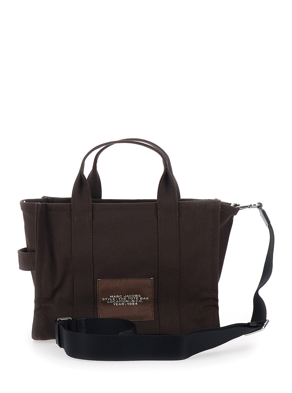 The Medium Tote Brown Bag with Contrasting Logo Lettering on Front in Cotton Woman Hand