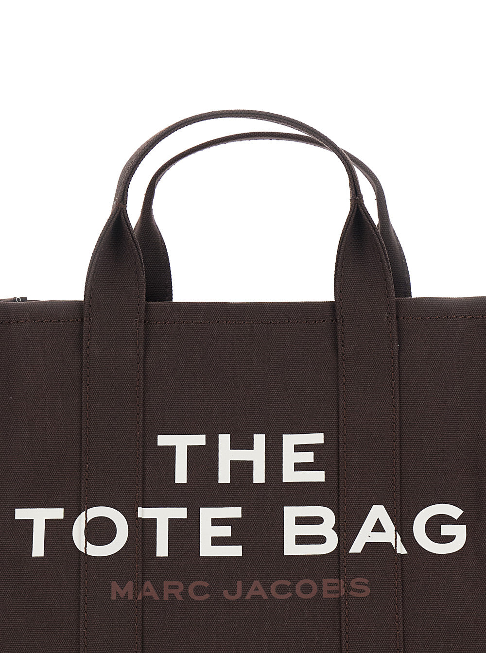 The Medium Tote Brown Bag with Contrasting Logo Lettering on Front in Cotton Woman Hand