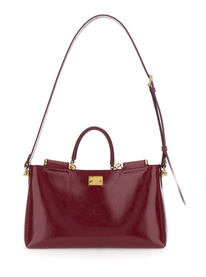 Handbag Vittoria with Adjustable Shoulder Strap and Logo Plate on Front in Bordeaux Leather for Women Calf Hand Bags