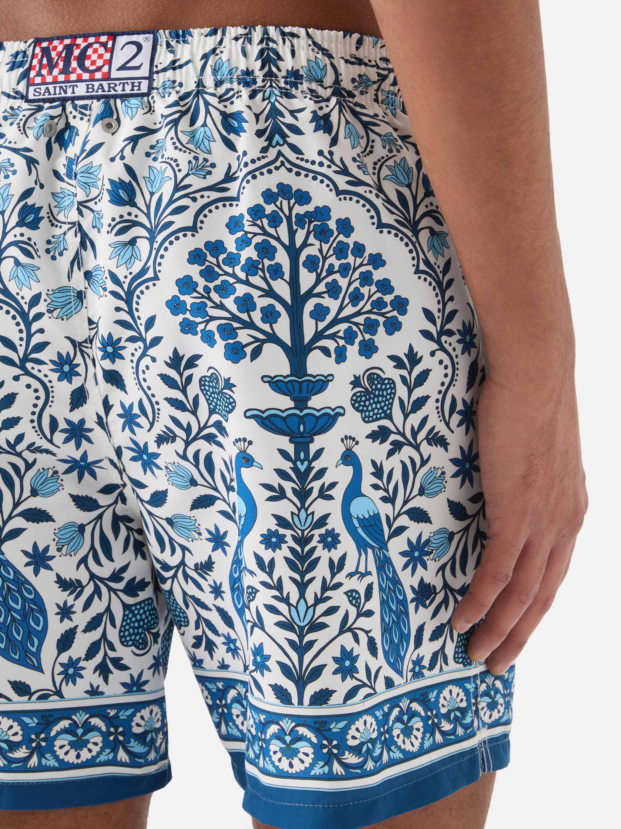 Gustavia White Swim Shorts With Contrasting Peacock Print Swimshort