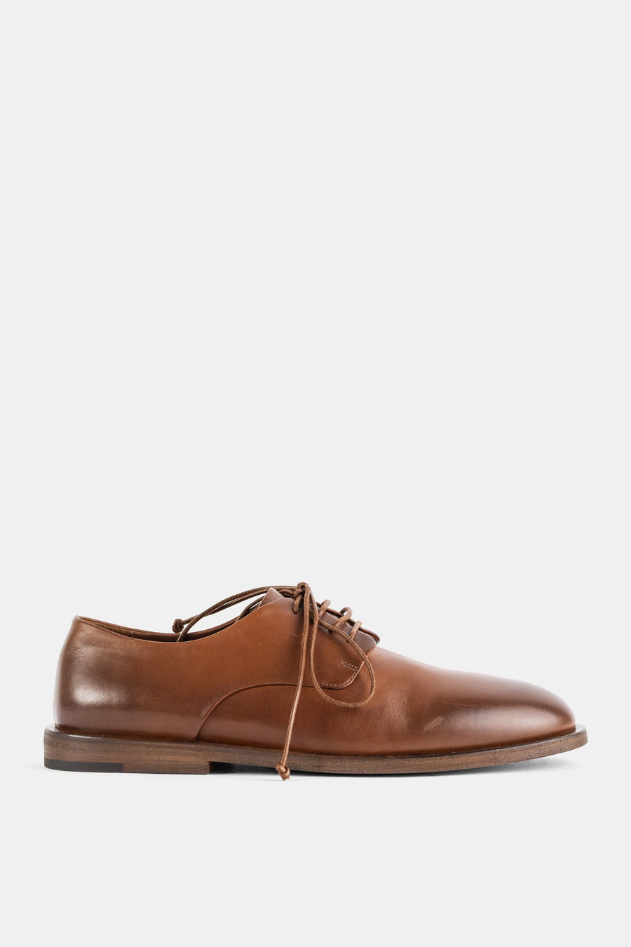 Marsell Smooth hazelnut brown calf leather with brushed waxed finish; leather sole with rubber walking insert derby flat in brown