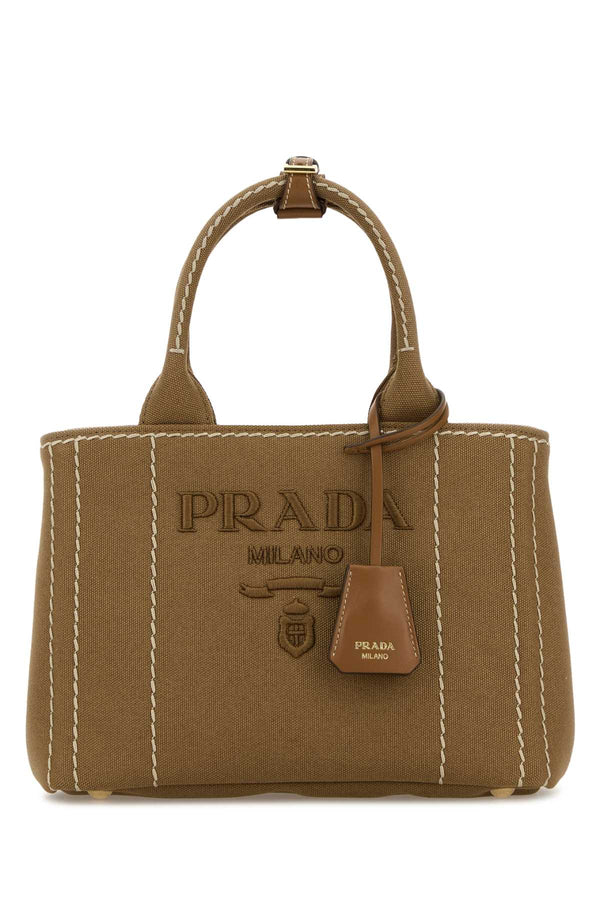 Prada Exterior: 100% Fabric; Lining: 100% Fabric; Finishing: Golden metal tote bag in beige