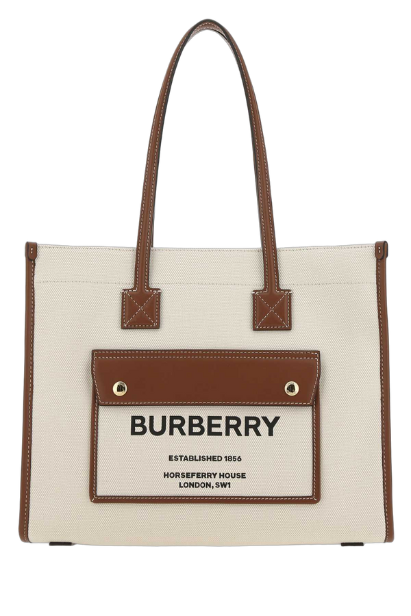 Burberry Exterior: 100% Cotton; Trim: 100% Calf; Lining: 100% Fabric; Finishing: Golden metal tote bag in beige