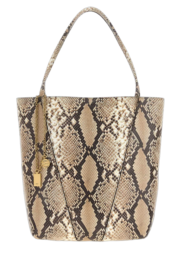 Chloé Exterior: 100% Leather; Lining: 100% Suede; Finishing: Golden metal tote bag in beige