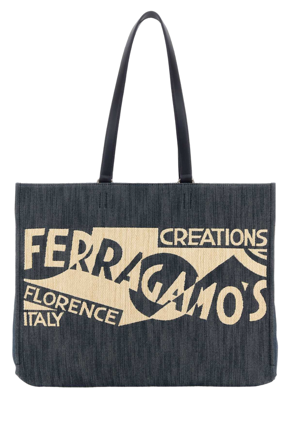 Ferragamo Sign Exterior: 100% Fabric; Lining: 100% Fabric; Finishing: Golden metal tote bag in blue