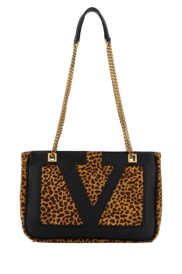 Valentino Garavani Exterior: 100% Calf hair; Lining: 100% Leather; Finishing: Antiqued golden metal shoulder bag in brown