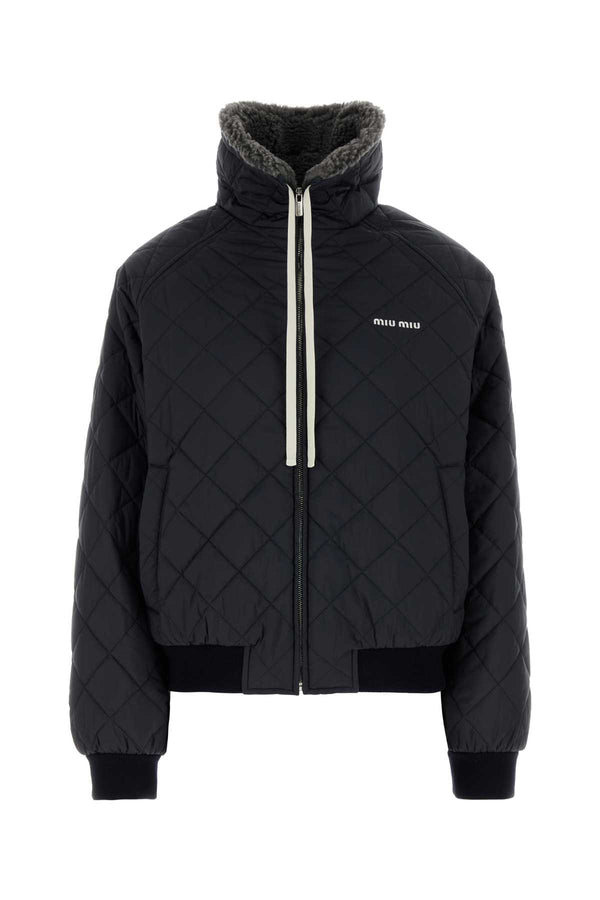 Miu Miu Exterior: 100% Recycled polyester; Lining: 67% Recycled polyester down jacket in navy