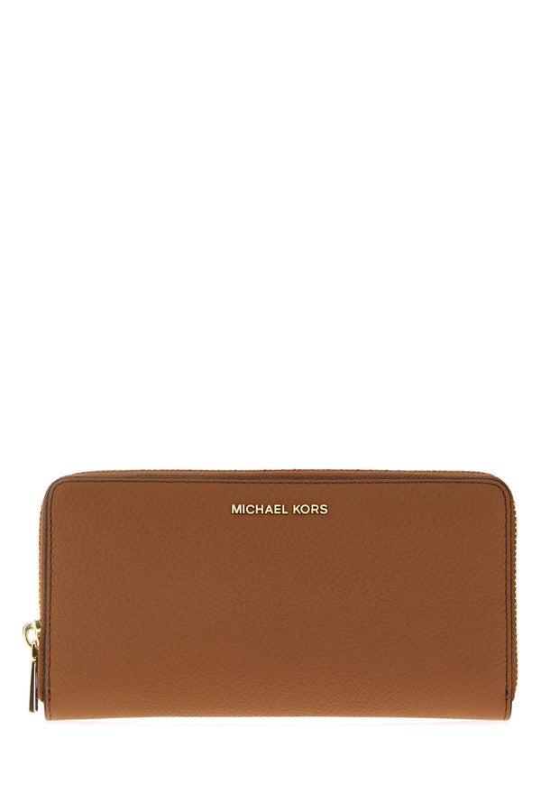 Michael By Michael Kors Slim Exterior: 100% Leather wallet in brown
