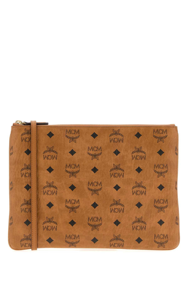 MCM Visetos Exterior: 100% Fabric; Lining: 100% Fabric; Finishing: Golden metal crossbody bag in cognac