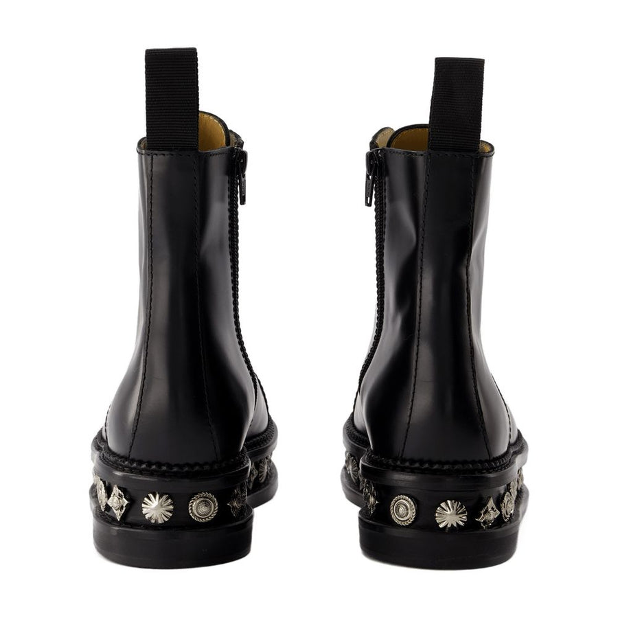Toga Pulla leather boots in black