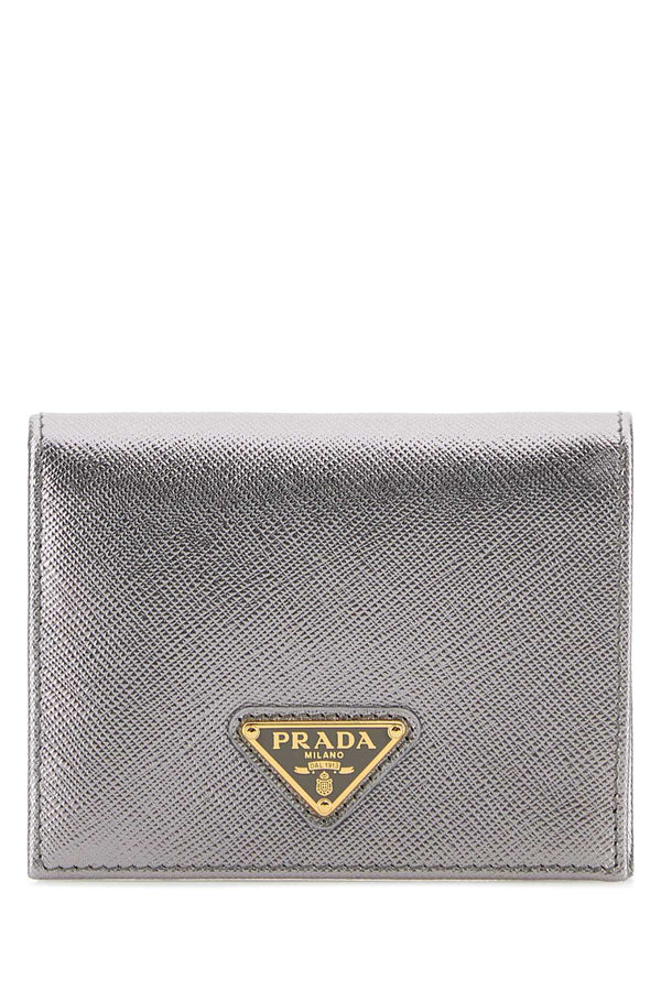 Prada Exterior: 100% Leather; Finishing: Golden metal wallet in silver