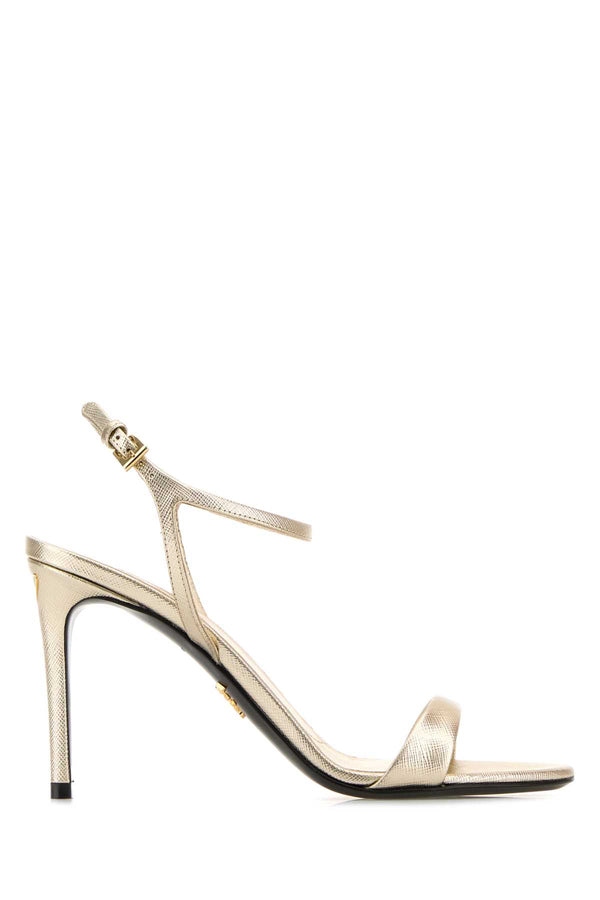 Prada Exterior: 100% Leather; Interior: 100% Leather; Sole: Leather and Rubber sandal in gold