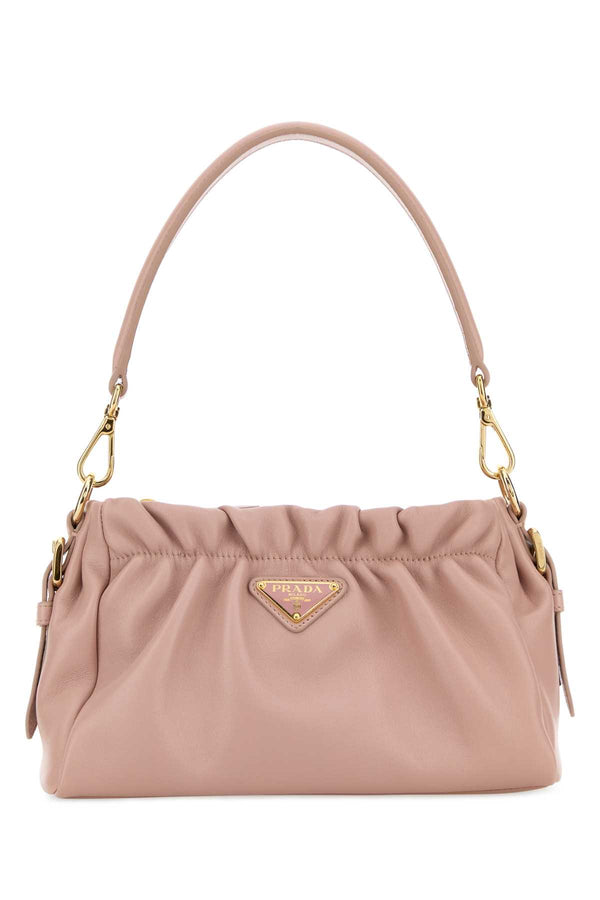 Prada Exterior: 100% Nappa leather; Lining: 100% Fabric; Finishing: Golden metal shoulder bag in pink