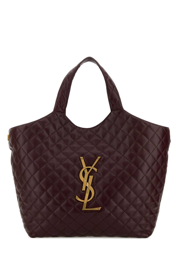 Saint Laurent Icare Exterior: 100% Lamb Nappa. Lining: 100% Fabric. Finishing: Antiqued golden metal tote bag in purple