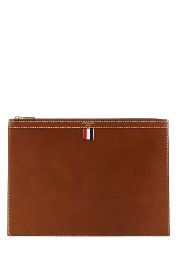 Thom Browne Exterior: 100% Leather; Lining: 100% Fabric; Finishing: Golden metal wallet in brown
