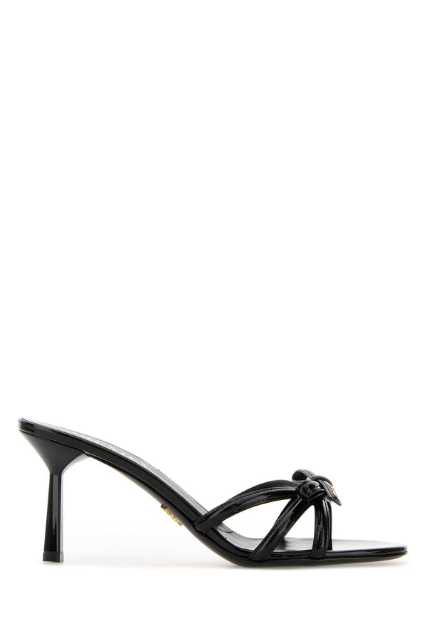 Prada Exterior: 100% Leather; Interior: 100% Leather; Sole: Leather and Rubber mule heel in black