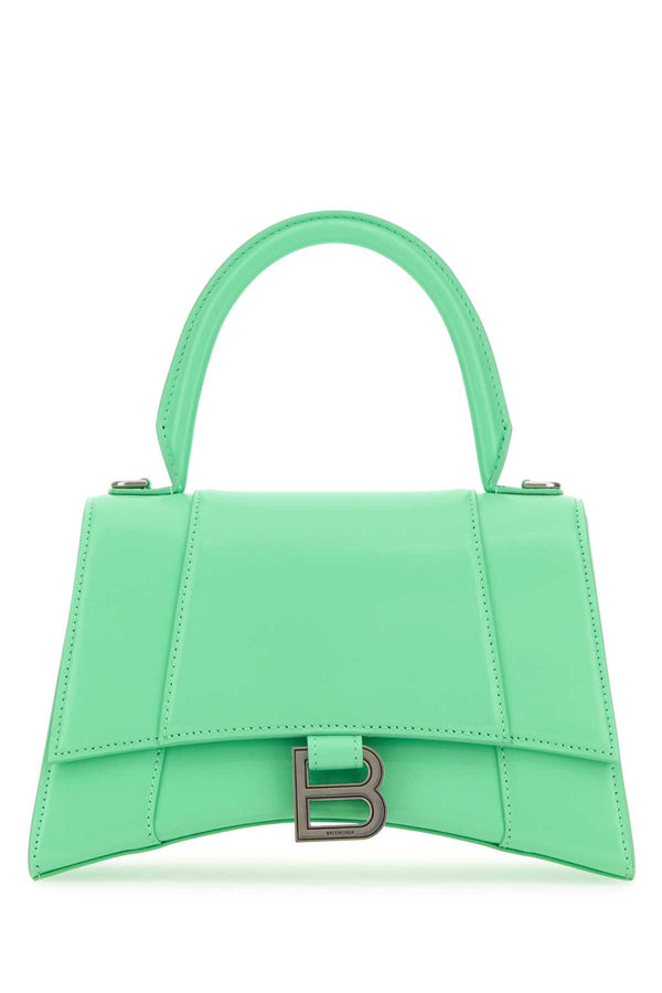 Balenciaga Exterior: 100% Calf. Lining: 100% Calf. Finishing: Gunmetal top handle bag in green