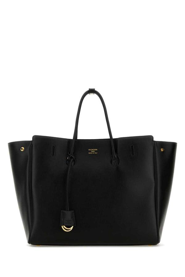 Balenciaga Exterior: 100% Calf. Lining: 100% Leather. Finishing: Golden metal tote bag in black