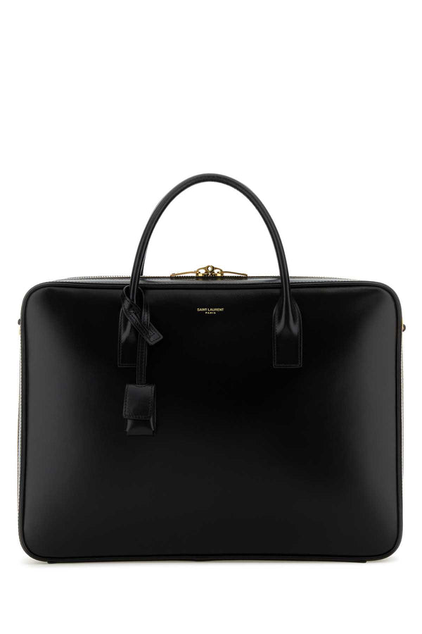 Saint Laurent Exterior: 100% Calf Lining: 100% Calf Finishing: Golden brass top handle bag in black