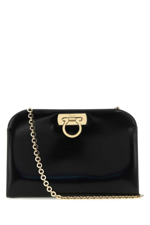 Ferragamo Exterior: 100% Calf; Lining: 100% Leather; Finishing: Platinum clutch in black