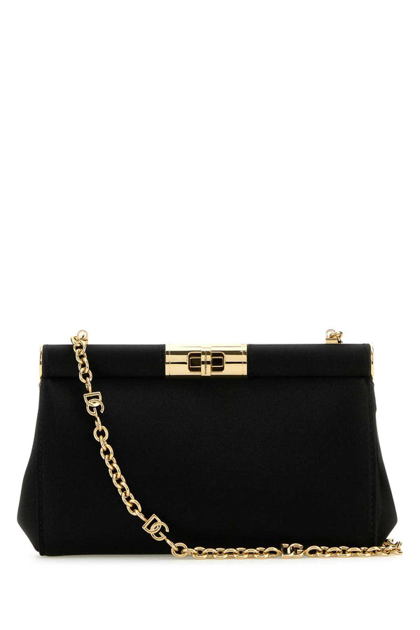 Dolce & Gabbana Exterior: 100% Fabric; Lining: 100% Fabric; Finishing: Golden metal clutch in black